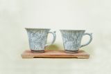 Tasse, hellgrau marmoriert mit Blumendekor